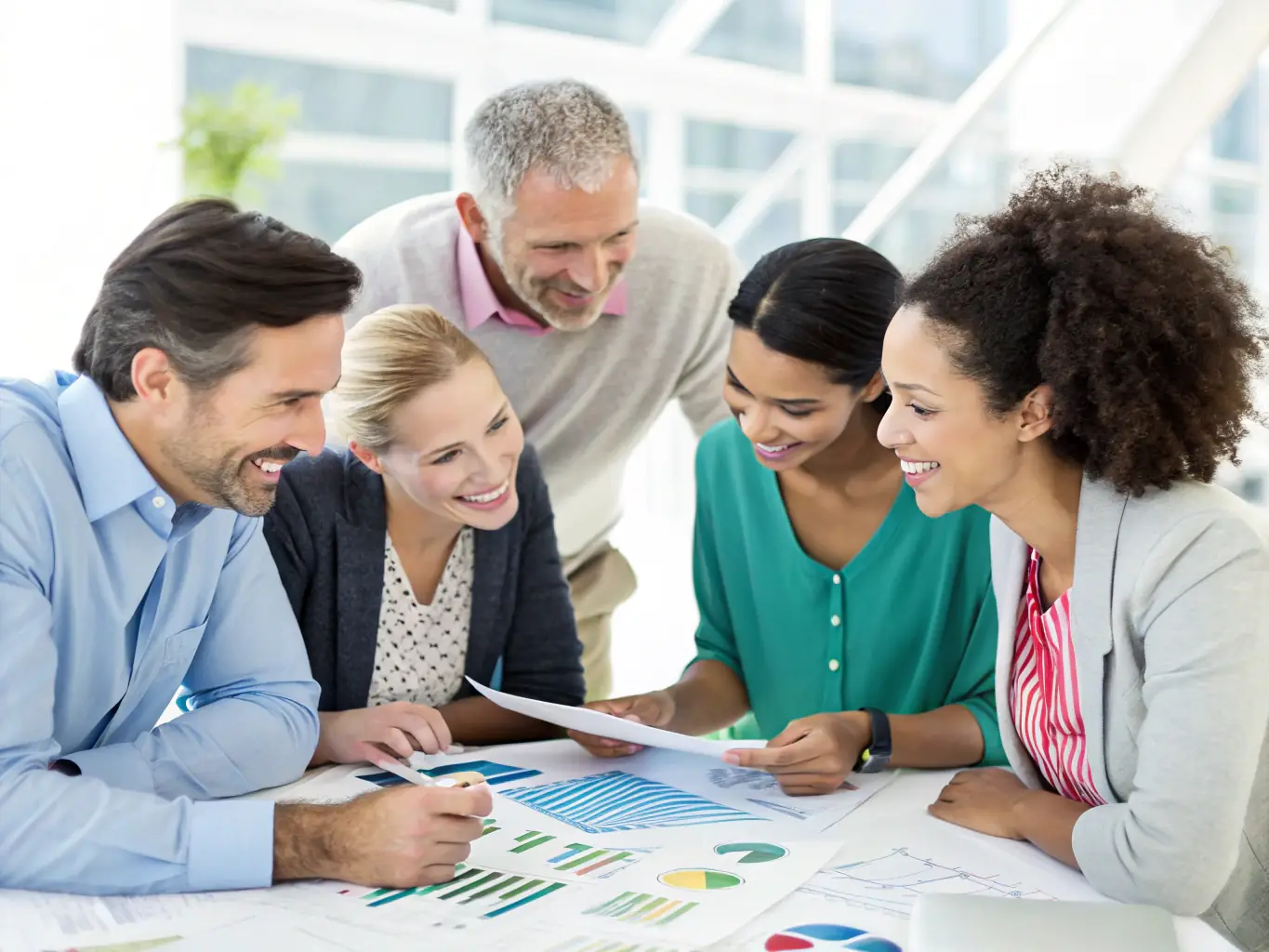 A diverse group of people, including LGBTQ+ individuals, collaborating on financial planning in a modern office setting, symbolizing inclusivity and teamwork.